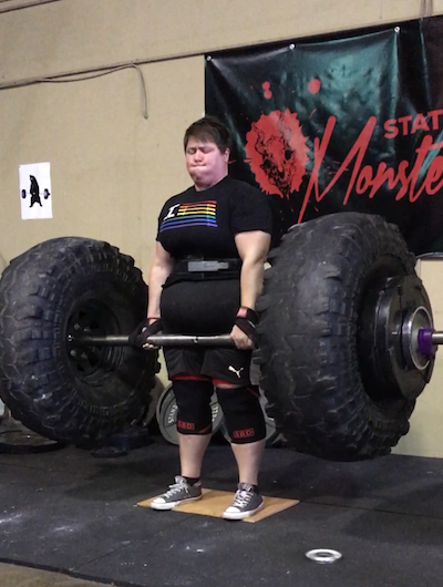 plus size woman lifting large weight