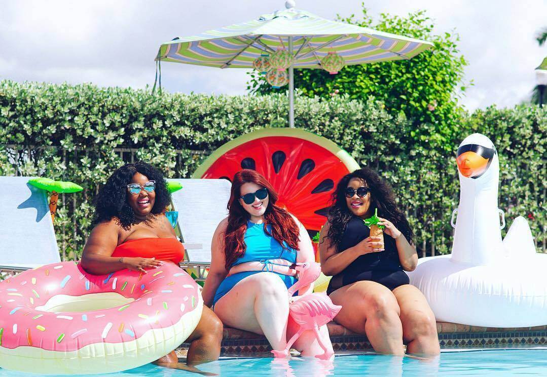 plus size pool party three women and pool floats