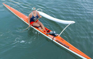 Dia and Co COO rowing in a paddle boat on the river.