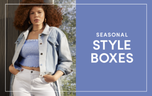 Plus size woman wearing a denim jacket and purple top.